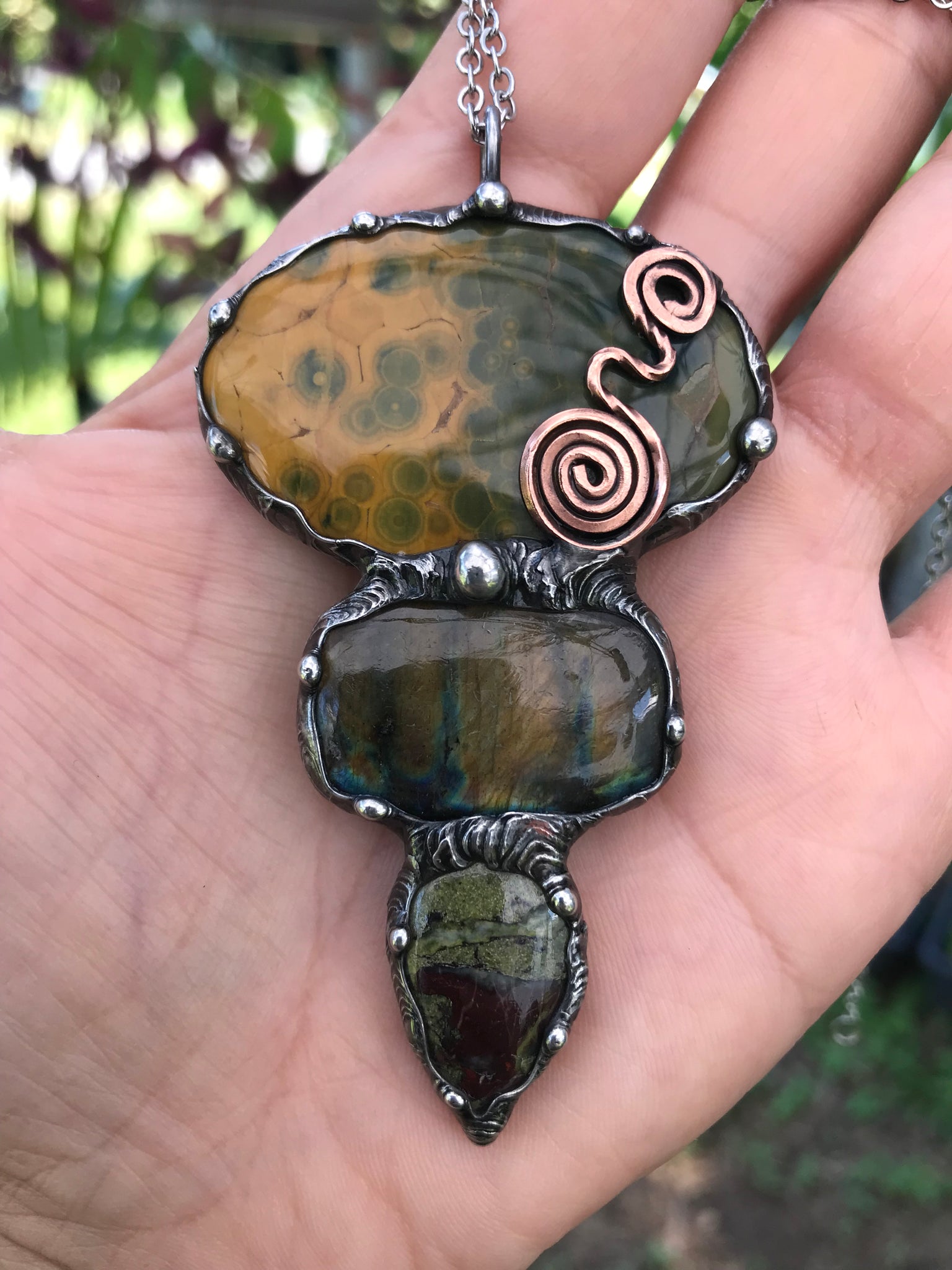 Ocean jasper Labradorite and Dragon Blood Jasper crystal pendant adorned eith a double spiral symbol