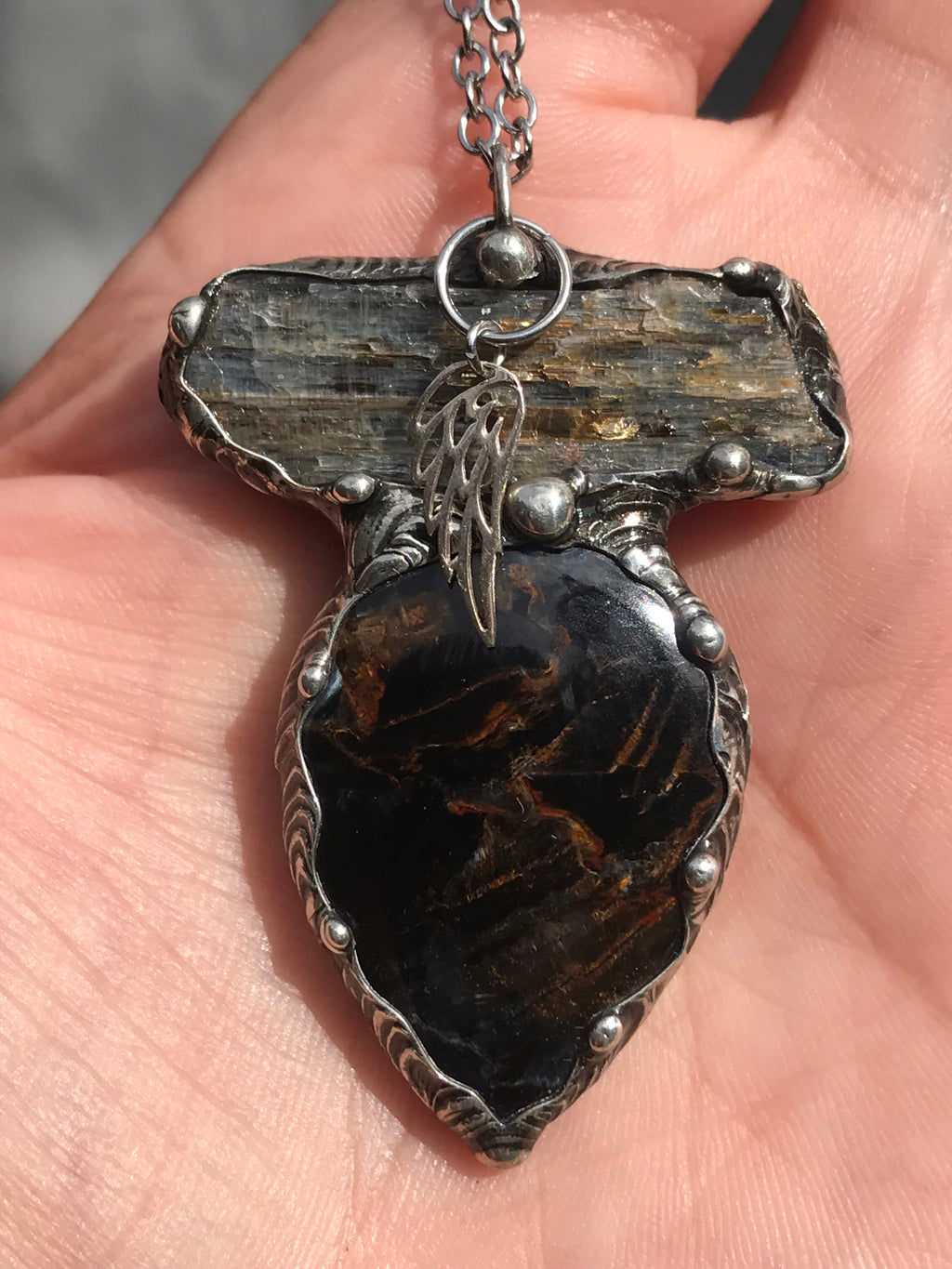 Pietersite and blue Kyanite magic adorned with a sterling silver wing
