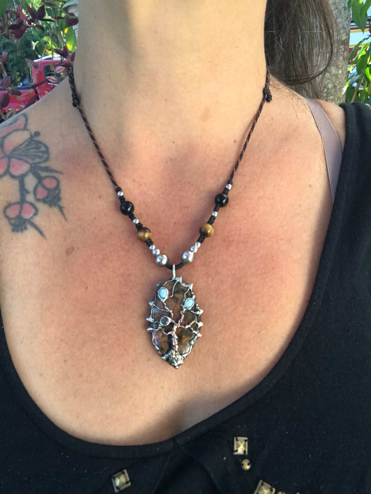 Twisted tree on brecciated jasper adorned with larimar and moonstone….tigereye in the strap