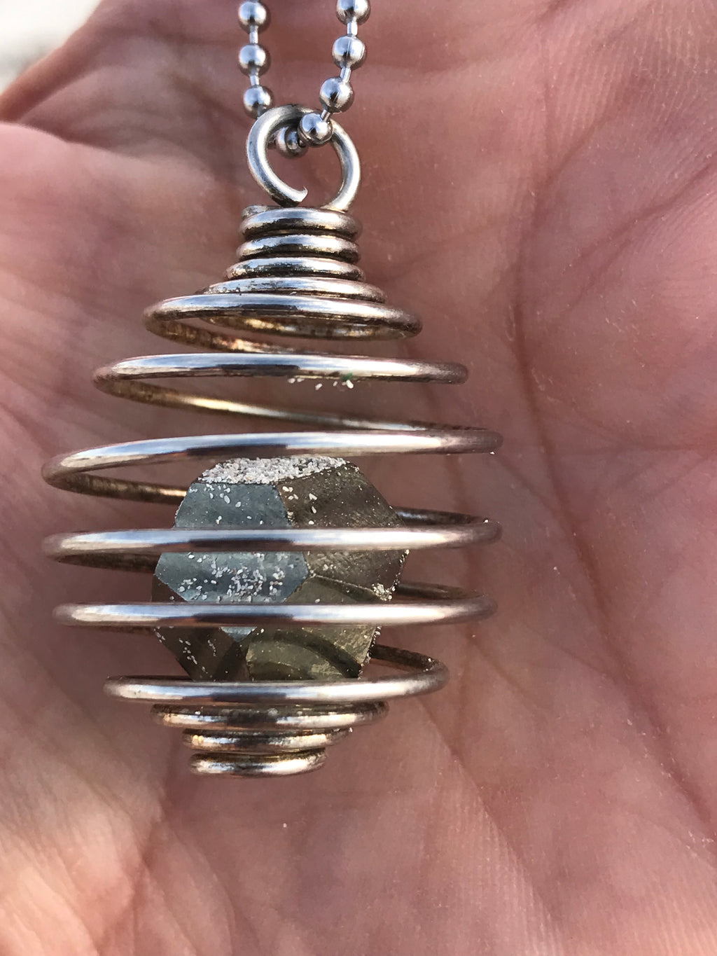 Reserved for Marisa pyrite cage pendant