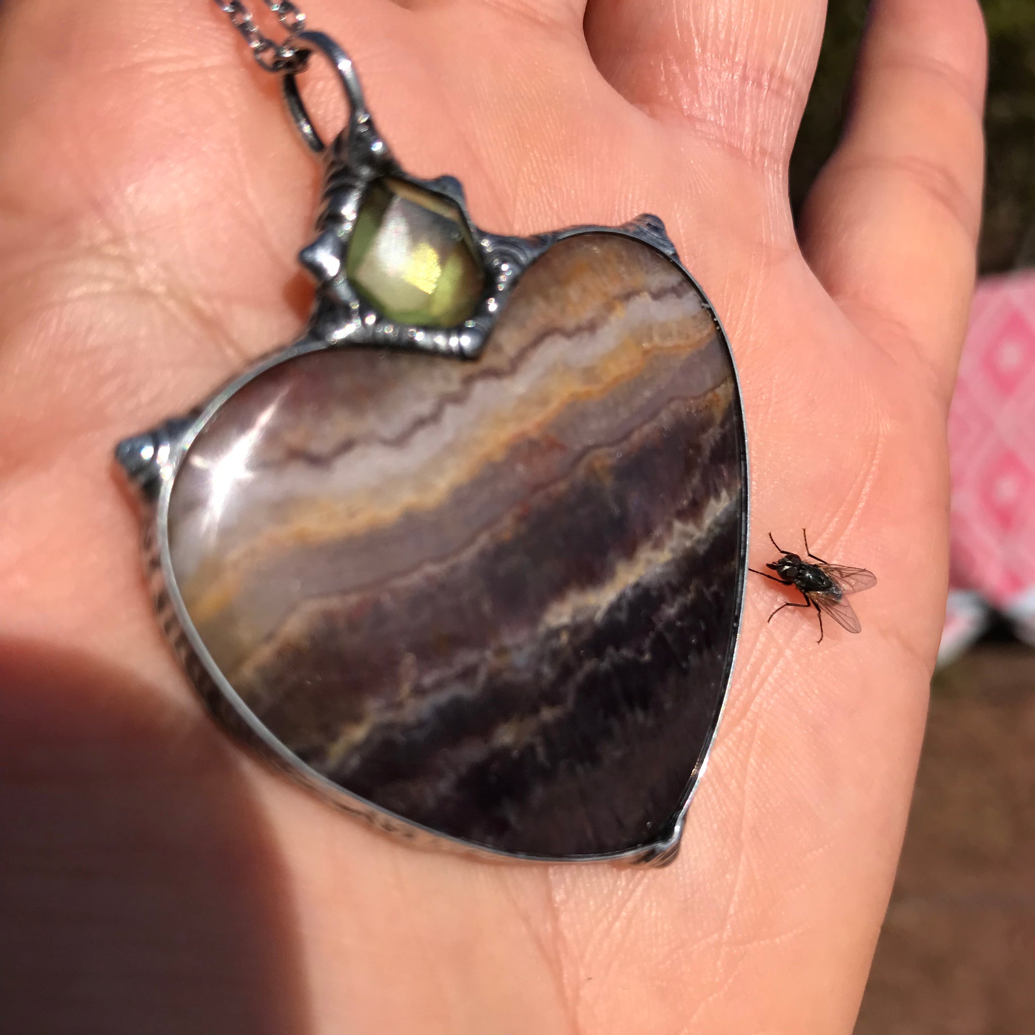 Banded agate and peridot Wealth through love for this earth