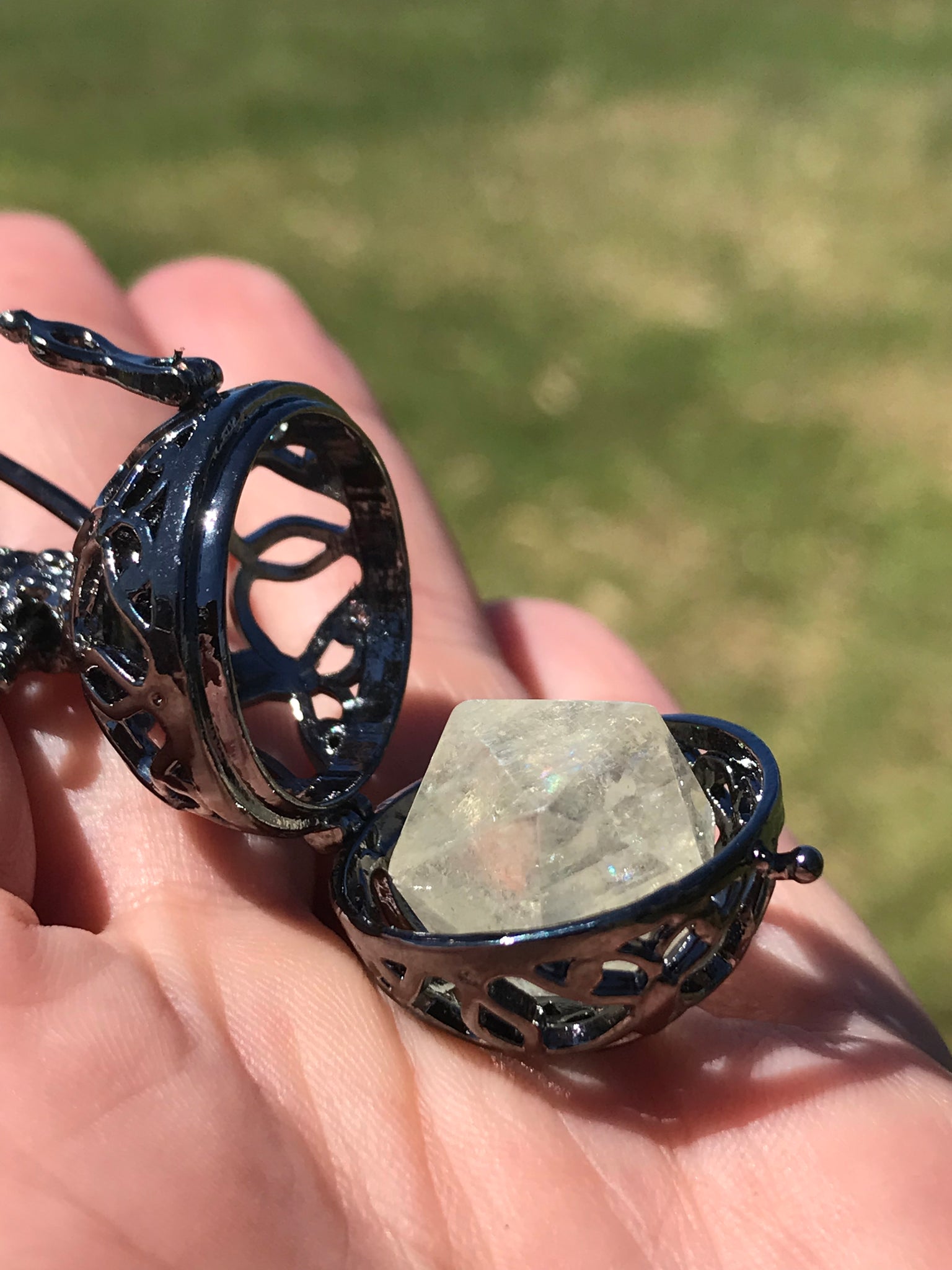 Reserved for Rachele Icosahedron Calcite within metal cage pendant