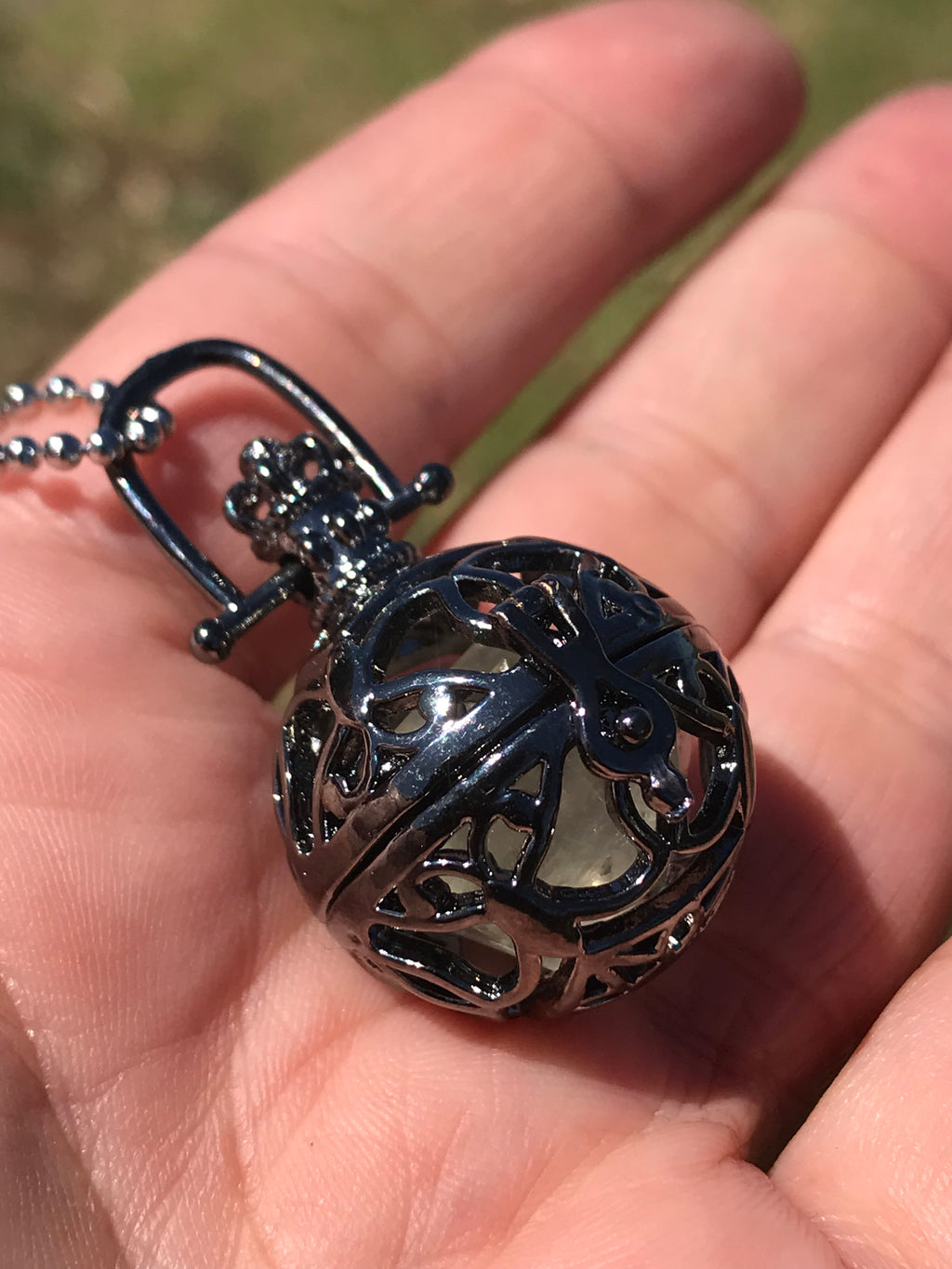 Reserved for Rachele Icosahedron Calcite within metal cage pendant